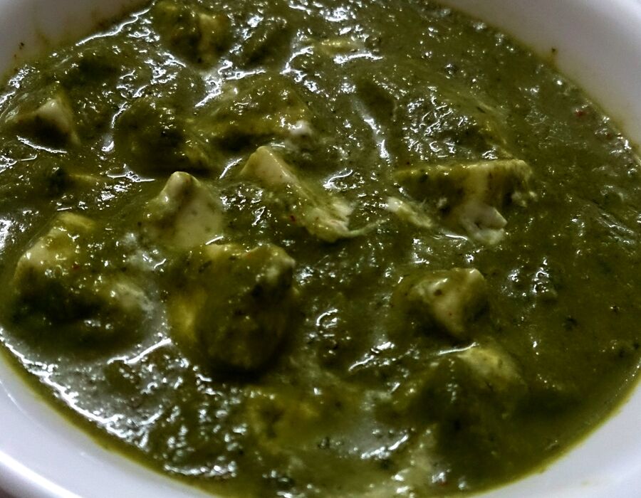 Palak Paneer, cottage cheese cubes in a smooth spinach curry