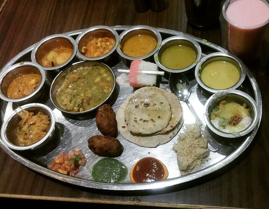 Rajasthani Vegetarian Thali with an assortment of curries, dal, roti and rice